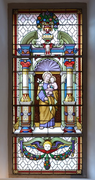 Saint Joseph stained glass window in the Saint Antony church in St. Ulrich in Gröden