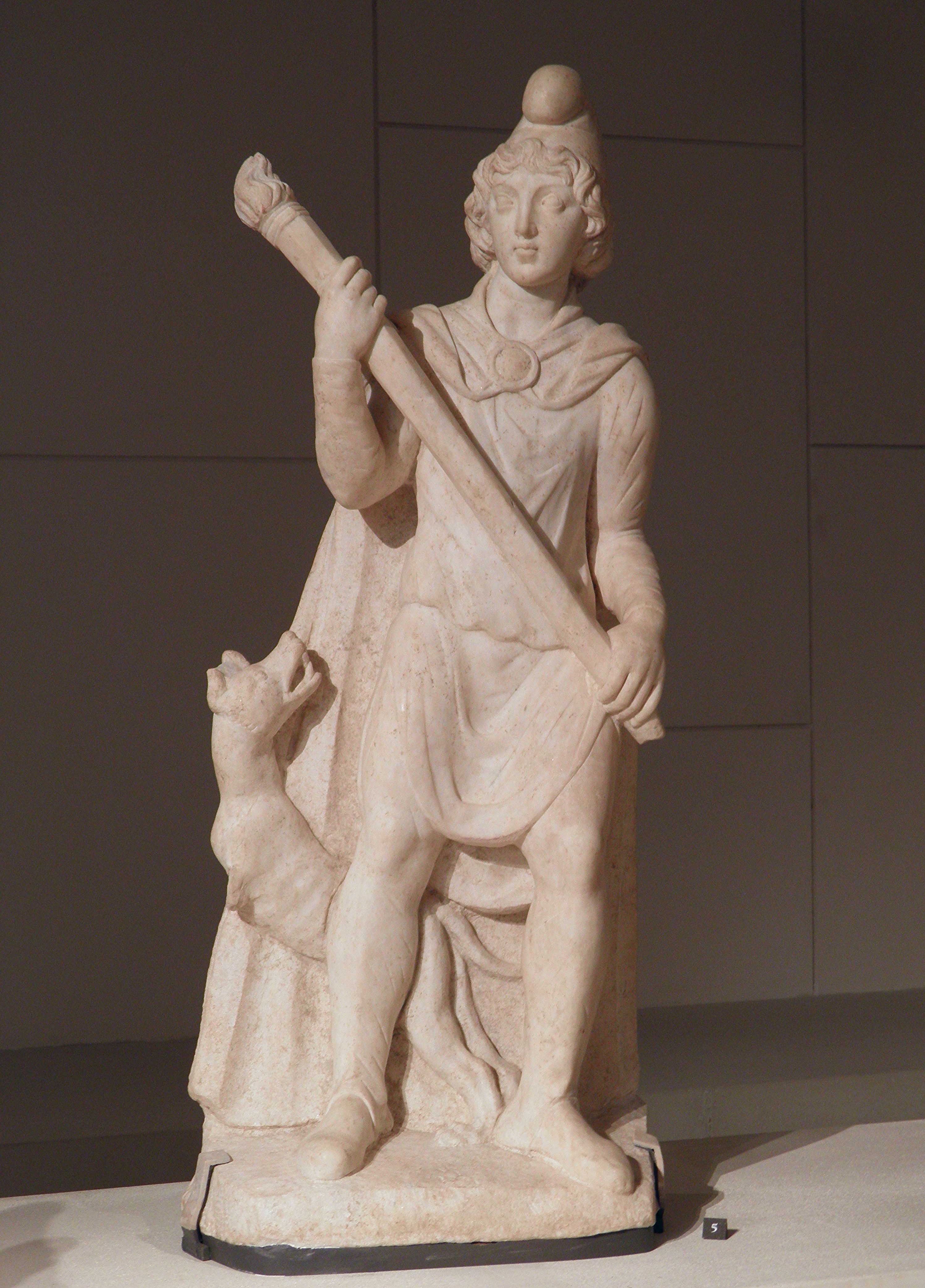 Marble statuette depicting Cautes holding his torch raised up (sunrise), from the Mithraeum at Sidon (Colonia Aurelia Pia, Syria), Louvre Museum (9362295423)