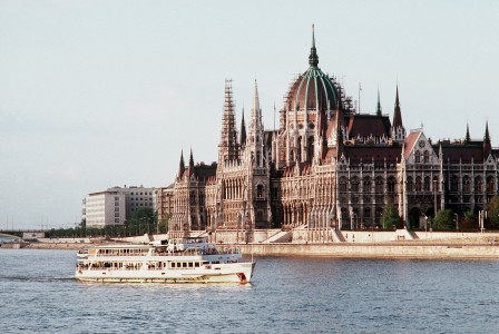 A tourist boat travels past Hungary's Parliament building, which was based on the design of the British Parliament.