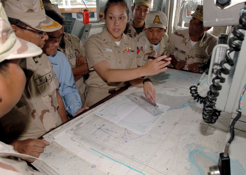 Defense.gov News Photo 101026-N-9156C-004 - U.S. Navy Lt. j.g. Vanessa Walton 4th from right navigator aboard the guided missile frigate USS Crommelin FFG 37 explains to officers with the