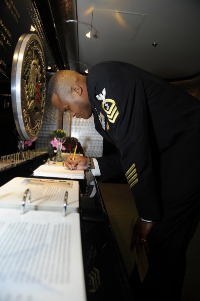 US Navy 100112-N-0555B-557 Chief Navy Career Counselor Jessie L. Jones Jr. writes a note during a tour of the Pentagon