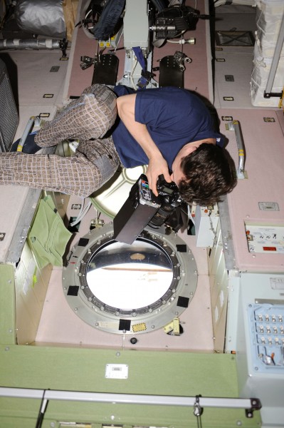 ISS-20 Roman Romanenko at a window in the Zvezda Service Module