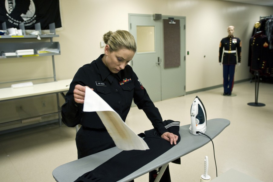 Ironing a U.S. Navy uniform