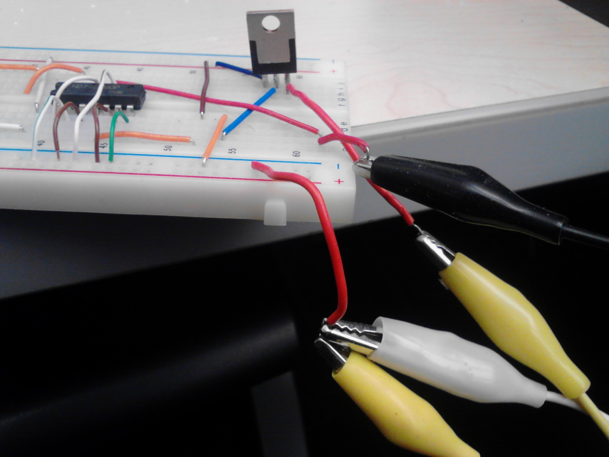 Alligator clips hooked up to wires and oscillator