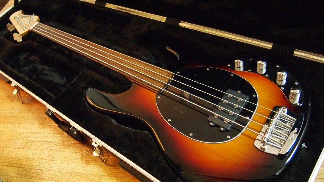 Music Man StingRay fretless bass in case angled
