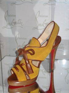 Christian Louboutin shoe at BATA Shoe Museum. The mirror display shows the red sole that his shoes are famous for.
