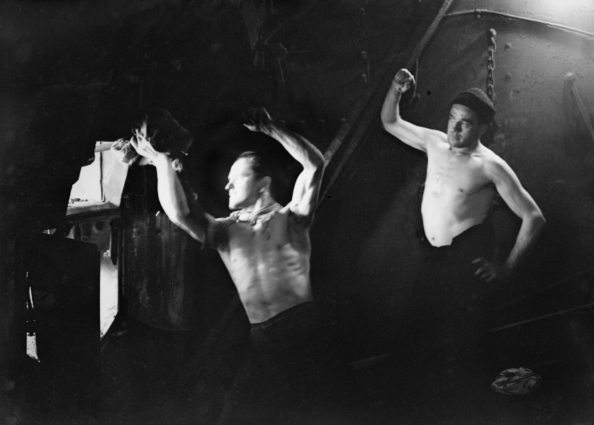 Stokers in the boiler room on board HMT STELLA PEGASI, Scapa Flow, 6 June 1943. A17189