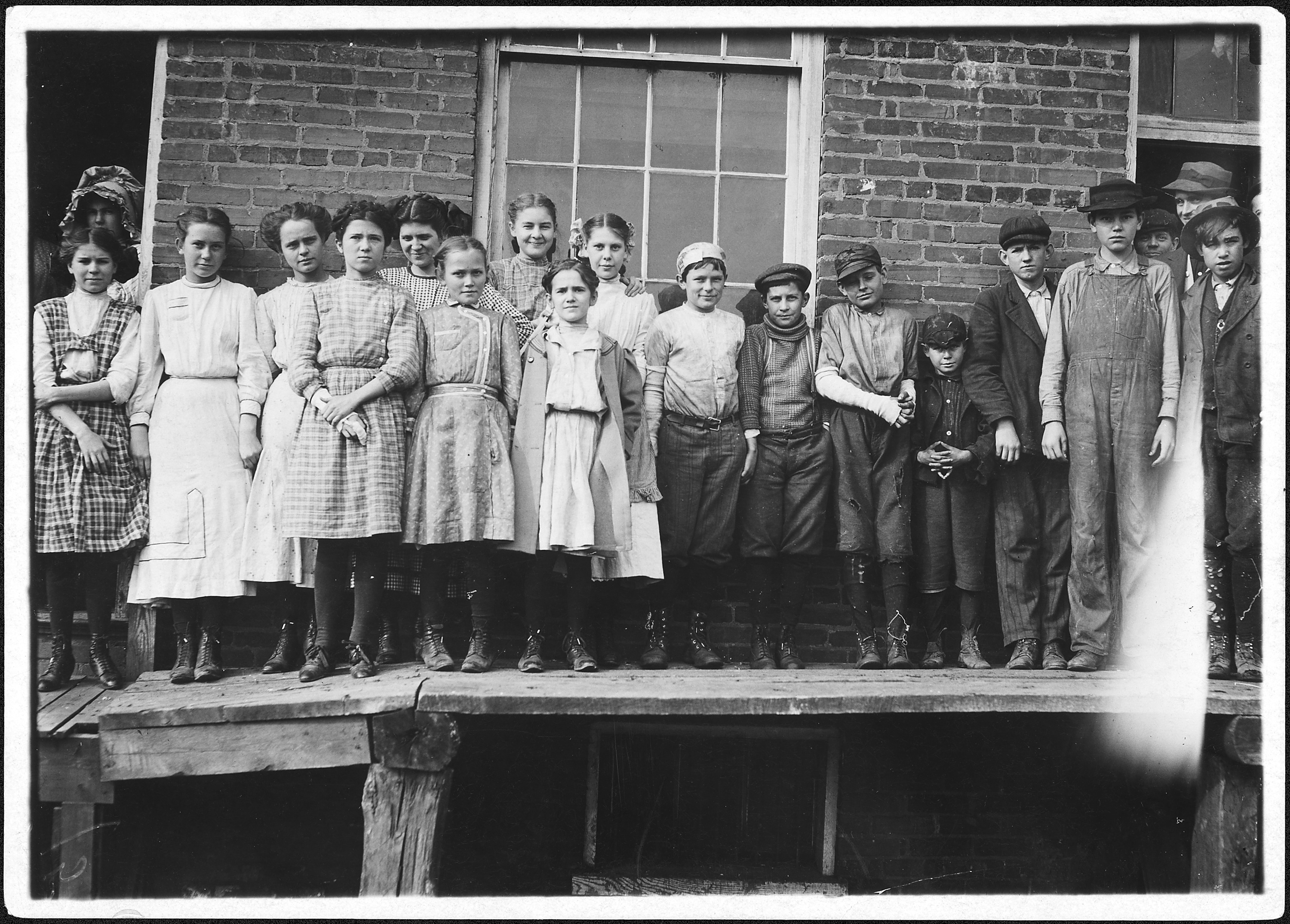 All except smallest boy work in Sweetwater Hosiery Co. He is a dinner carrier, but others like him and smaller work... - NARA - 523367