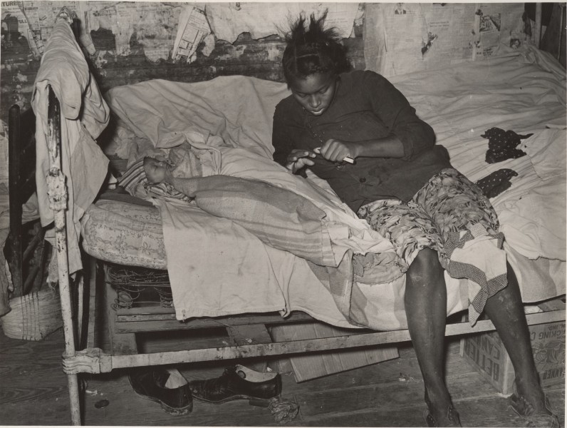 -African American Mother and Child on Bed in their Cabin near Jefferson, Texas- MET DP212792