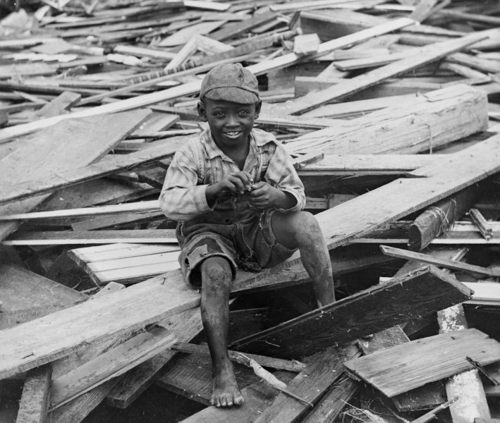 No Known Restrictions Young Boy Sits on Galveston Hurricane Debris by M.H. Zahner, 1900 (LOC) (493281477)