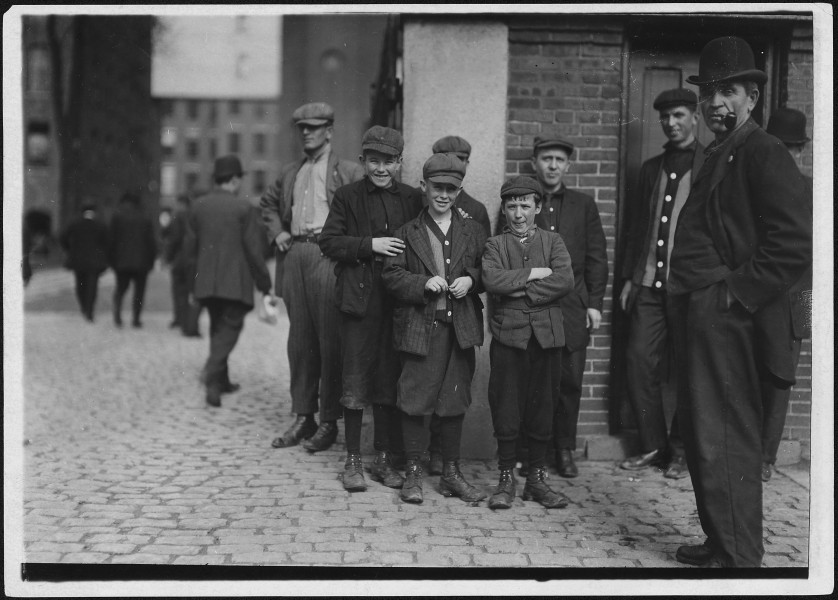 Workers in Merrimac Mill. Robert, smallest, 12 years old. Michael Keefe, next in size, about 13 or 14 years old.... - NARA - 523483
