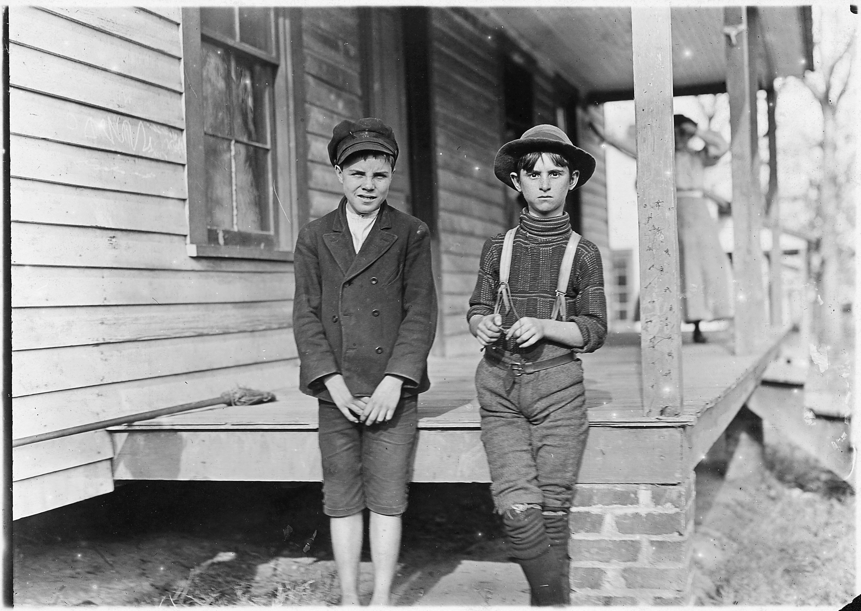 Springstein Mill. John Lewis (boy with hat), 12 years old, 1 year in mill. Weaver - 4 looms. 40 (cents) a day to... - NARA - 523117