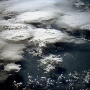 This photograph, acquired in February 1984 by an astronaut aboard a space shuttle, shows a series of mature thunderstorms located near the Parana River in southern Brazil. With abundant warm temperatures and moisture-laden air in this part of Brazil, large thunderstorms are commonplace. A number of overshooting tops and anvil clouds are visible at the tops of the clouds. Storms of this magnitude can drop large amounts of rainfall in a short period of time, causing flash floods.
