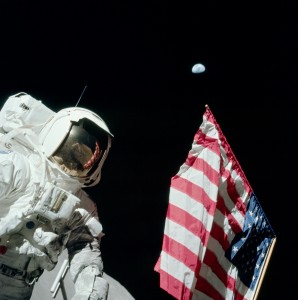 During the first EVA of Apollo 17, Eugene Cernan photographed Harrison Schmitt with the American flag and the Earth,400 000km away,in the background. The chest-mounted RCU and the camera bracket are clearly visible. Cernan is visible in the reflection in Schmitt's helmet visor in the awkward position he assumed to obtain this image