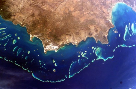Astronaut made photograph of the Great Barrier Reef
Far Northern Section of the Great Barrier Reef. Northern Cooktown, Queensland: Cape Melville (right).
The image is oriented with north aproximately to the right.