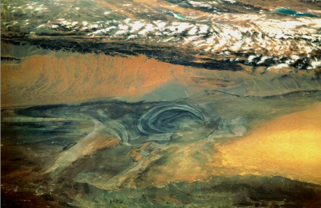 China, Xinjiang, desert Lop Nur. Satellite picture of the Basin of the formerly sea Lop Nur in the Desert of Lop. In the foreground Kuruktagh, in the background Kumtagh and Astintagh. A duststorm is blowing to the west over the Desert of Lop. Two lakes appear in a break in the clouds covering the Plateau of Astintagh. Visible are elongated Ayakkum Hu Lake south-southwest of Lop Nur and small blue-green Gas Hu Lake.