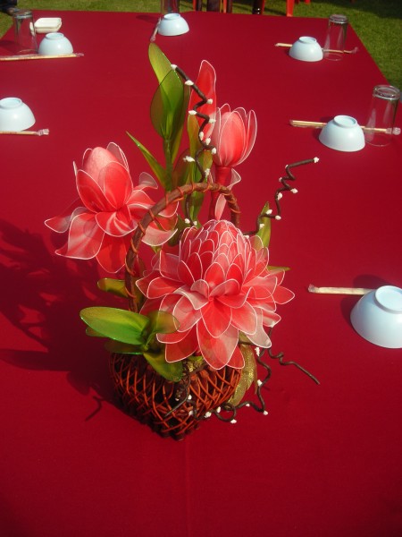 Red artificial flower as table decoration