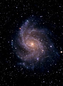 NGC6946. NGC 6946 (Arp 29) is a face-on SAB(rs)cd galaxy in the constellation Cygnus. This classification refers to the presence of a small core with multiple well-defined arms (cd), with a poorly-developed bar across the middle (AB) and an inner confused ring (rs). Nearly twenty million light years from Earth, it is over seventy thousand light years across.
Date: 1999.
Technical information: Image taken using the Wide Field Camera on the Isaac Newton Telescope