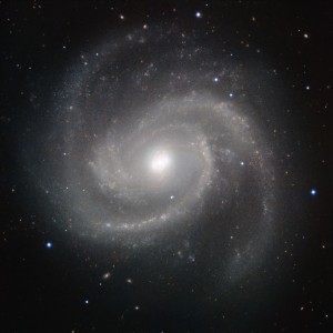 This galaxy is Messier 100, also known as NGC 4321, which was discovered in the 18th century. About 55 million light-years from Earth, Messier 100 is part of the Virgo Cluster of galaxies and lies in the constellation of Coma Berenices (BereniceвЂ™s Hair, named after the ancient Egyptian queen Berenice II). The image was made in infrared light with the HAWK-I camera on ESOвЂ™s Very Large Telescope at Paranal Observatory in Chile. HAWK-I is one of the most powerful infrared imagers in the world, and this is one of the sharpest and most detailed pictures of this galaxy ever taken from Earth. The filters used were Y (shown here in blue), J (in cyan), H (in orange), and K (in red). The field of view of the image is about 6.4 arcminutes.