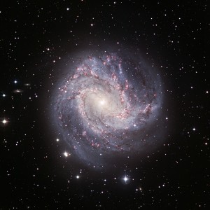 If our Milky Way were to resemble this one, we certainly would be proud of our home! The beautiful spiral galaxy Messier 83 [4] is located in the southern constellation Hydra (the Water Snake) and is also known as NGC 5236 and as the Southern Pinwheel galaxy. Its distance is about 15 million light-years. Being about twice as small as the Milky Way, its size on the sky is 11x10 arcmin2.. The image show clumpy, well-defined spiral arms that are rich in young stars, while the disc reveals a complex system of intricate dust lanes. This galaxy is known to be a site of vigorous star formation.
