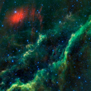 This infra-red image from NASAвЂ™s WISE (Wide-field Infrared Survey Explorer) features one of the bright stars in the constellation Perseus, named Menkhib (the bright star in the upper left near the red dust cloud) along with a large star forming cloud catalogued as NGC 1499, or more commonly called the California Nebula (running diagonally through the image). Menkhib is one of the hottest stars visible in the night sky; its surface[]Sun). Because of its high temperature it appears blue-white to the human eye (almost all stars appear bluish to WISE). It has about 40 times the mass of the Sun and gives off 330,000 times the amount of light. Menkhib is a runaway star, and the fast stellar wind it blows is piling up in front of it to create a shock wave in the gas and dust surrounding it in the space between the stars. This shock wave is heating up the dust within and WISE sees it as the red cloud in the upper left of the image. Menkhib is part of an association of very hot stars that were born from the California Nebula only a few million years ago. These stars are lighting up the nebula; heating and ionizing it. In visible light, the ionized gas glows red, while in infra-red light we see the heated dust (which appears in green and red in this image from WISE). The California Nebula gets its name due to a resemblance to the shape of the U.S. State of California (which you can just make out as outlined by the green dust if you rotate the image by a little more than 90 degrees clockwise). The entire California Nebula stretches across about 100 light-years, and we see about 80% of it in this view.