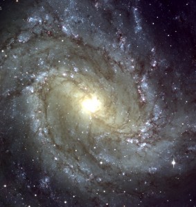 This image of a well-known spiral galaxy, Messier 83, was prepared by superposing three CCD frames from this data release that are now available in the archive. This galaxy is located in the southern constellation Hydra (The Water-Snake) and is also known as NGC 5236; the distance is about 15 million light-years. The spiral structure resembles that of the Milky Way Galaxy in which we live, but Messier 83 also possesses a bar-like structure at the centre.
This photo shows the central region of a beautiful spiral galaxy, Messier 83 , as observed with the FORS1 instrument at VLT ANTU . It is based on a composite of three images, all of which are now available from the ESO Science Data Archive , as described in this Press Release. The three frames were taken in March 1999 through three different filters: B (wavelength 429 nm; Full-Width-Half-Maximum (FWHM) 88 nm; exposure time 10 min; here rendered as blue), R (657 nm; 150 nm; 3 min; green) and I (768 nm; 138 nm; 3 min; red) during a period of 0.8 arcsec average seeing. The field shown measures about 6.8 x 6.8 arcmin and the images were recorded in frames of 2048 x 2048 pixels, each measuring 0.2 arcsec. North is up; East is left.
Compare also with PR Photo 20/98 (in B/W) of a small area in this galaxy that was obtained with the VLT Test Camera in June 1998.