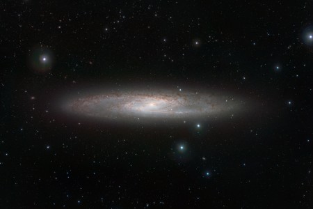 NGC 253 is one of the closest galaxies to our own. It is a bright spiral that lies about 13 million light-years from Earth in the southern constellation of Sculptor and is noted for being a starburst galaxy with very vigorous star formation and very dusty spiral arms. In the infrared, the rich dust clouds in the galaxyвЂ™s spiral arms become nearly transparent and a whole host of cool red stars that are otherwise invisible can be seen. The VISTA infrared images were taken through Y, Z, J, Ks and narrowband filters. The field of view is about 38 by 25 arcminutes.