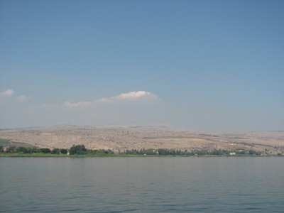 The Sea of Galilee, also Kinneret, Lake of Gennesaret, or Lake Tiberias, is the largest freshwater lake in Israel, and it is approximately 53 km in circumference, about 21 km long, and 13 km wide. The lake has a total area of 166 km2, and a maximum depth of approximately 43 m. At 214 metres below sea level, it is the lowest freshwater lake on Earth and the second-lowest lake in the world (after the Dead Sea, a saltwater lake). Much of the ministry of Jesus occurred on the shores of Lake Galilee. In those days, there was a continuous ribbon development of settlements and villages around the lake and plenty of trade and ferrying by boat. The Synoptic gospels of Mark (1:14-20), Matthew (4:18-22), and Luke (5:1-11) describe how Jesus recruited four of his apostles from the shores of Lake Galilee: the fishermen Simon and his brother Andrew and the brothers John and James. One of Jesus' famous teaching episodes, the Sermon on the Mount, have been given on a hill overlooking the lake. Many of his miracles are also said to have occurred here including his walking on water, calming the storm, the disciples and the boatload of fish, and his feeding five thousand people (in Tabgha).<br>Name of photo's author: Free-Photos.biz<br>This photo was taken in: The Sea of Galilee, not far from the Sermon Mountain
