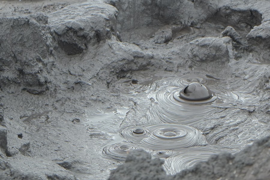 Bubbling mud with bursting mud bubble (Hell's Gate thermal area)