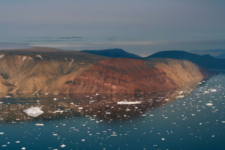 Red Cliffs and icebergs in Greenland
