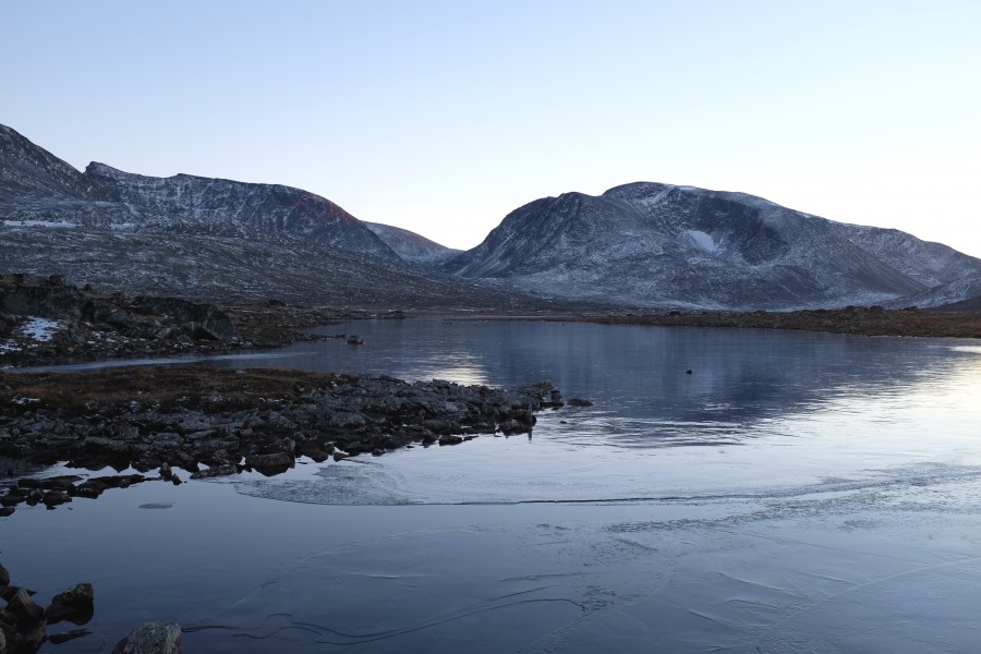Thin layer of ice over Åmotsvatnet lake in Dovrefjell National Park, Norway