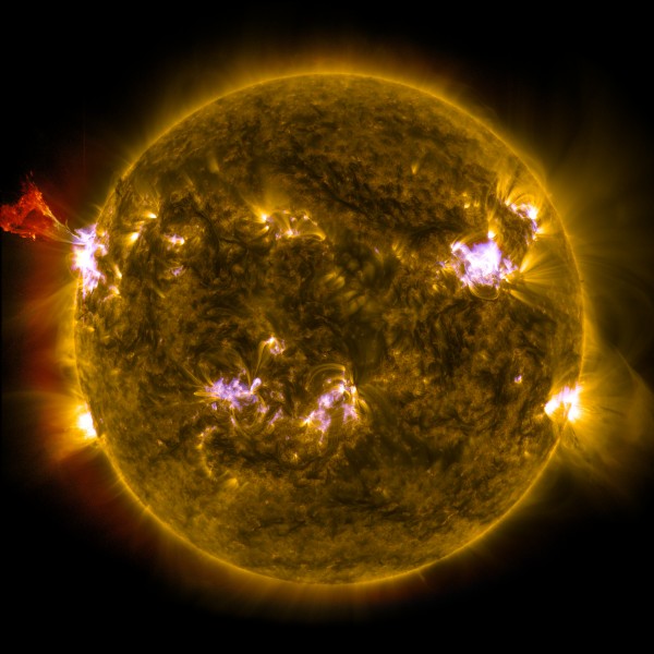 A burst of solar material leaps off the left side of the sun in what’s known as a prominence eruption