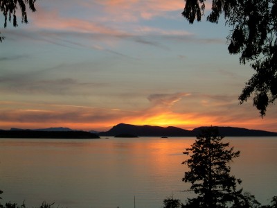 View from YMCA Camp Orkila's Chapel Ridge showing a typical sunset over Waldron Island and the Canadian Gulf Islands.