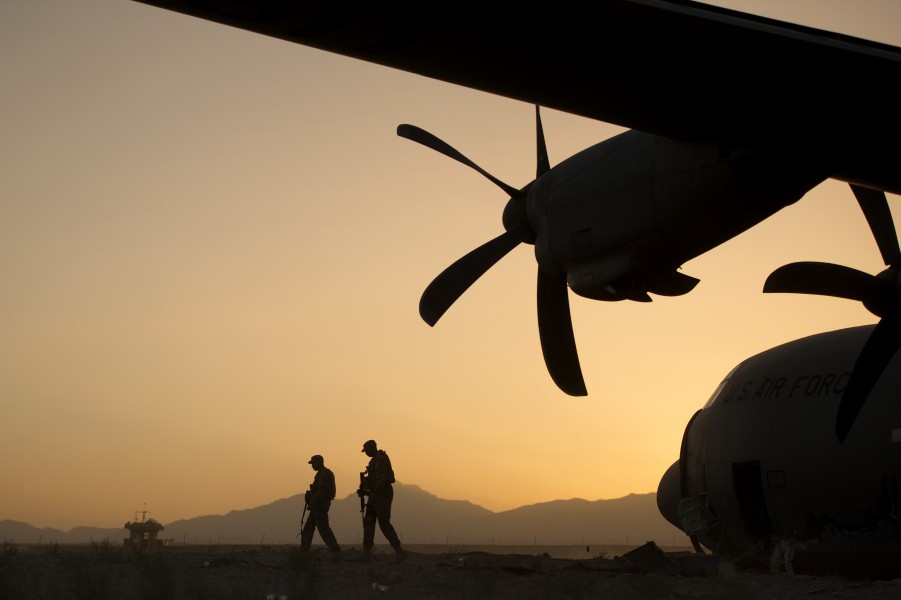 U.S. Air Force Airman 1st Class Christian Mejia and Staff Sergeant Duron Arnold, both with the 376th Expeditionary Security Forces Squadron fly-away security team, perform a security check around a disabled 130606-F-YL744-038