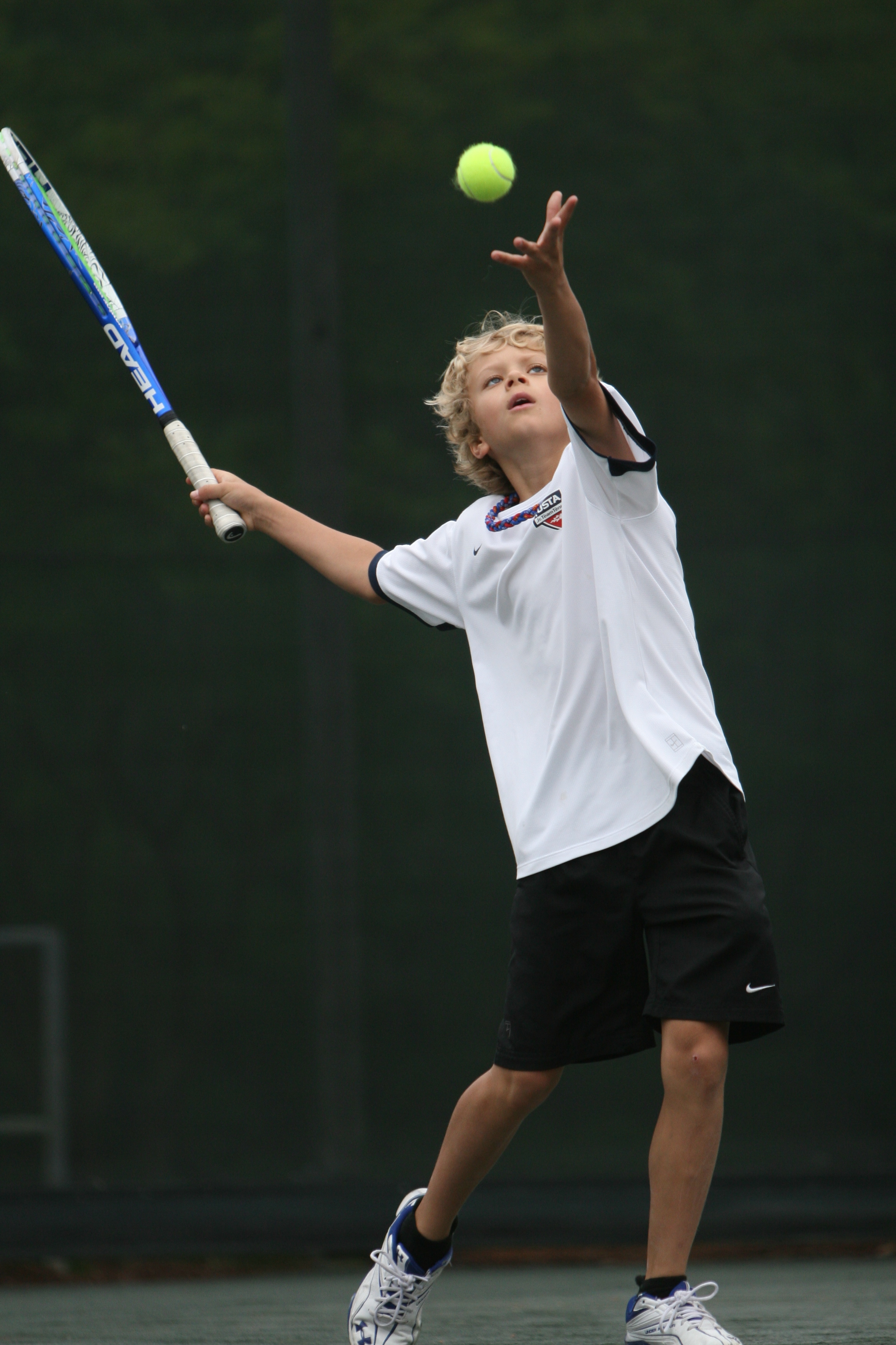 Boy playing Tennis