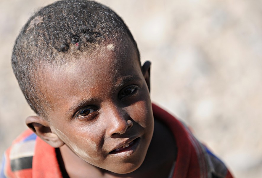 A Djiboutian boy takes a break from playing with his friends in Karabti San, Djibouti, Jan. 3, 2012 120103-F-UE958-848