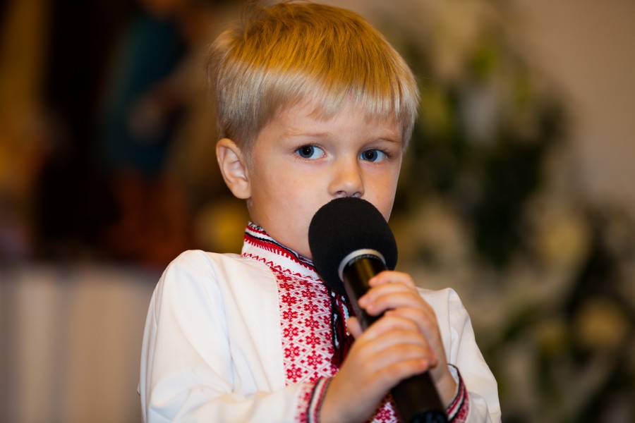 a handsome fair-haired young Catholic boy in a Catholic kindergarten photographed in November 2013