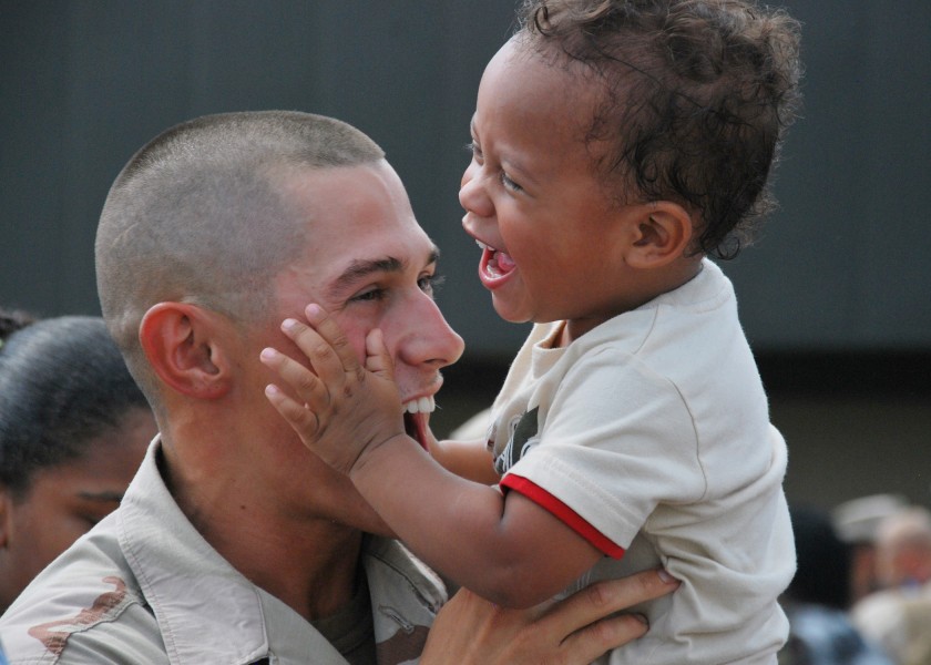 Defense.gov News Photo 100721-N-7084M-871 - A U.S. Navy sailor assigned to Naval Mobile Construction Battalion 133 greets his son during a homecoming ceremony for the unit in Gulfport Miss.
