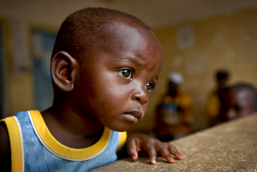 US Navy 081007-N-8977L-092 A boy waits with his mother for his malaria lab results at a dispensary in Tanga, Tanzania during a medical civic action project