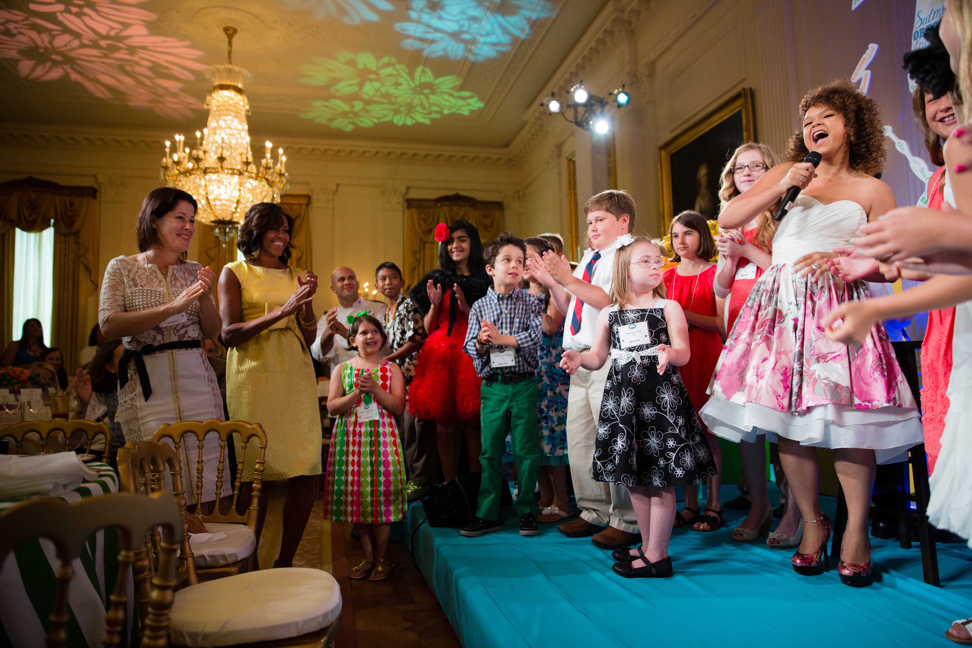 Michelle Obama dances as Rachel Crow performs during the Kids' State Dinner, 2013