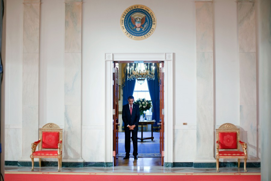Barack Obama waiting at the door of the Blue Room