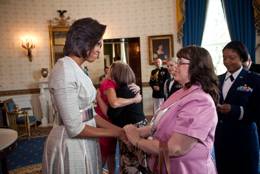Michelle Obama greets guests in the Blue Room of the White House, May 2011
