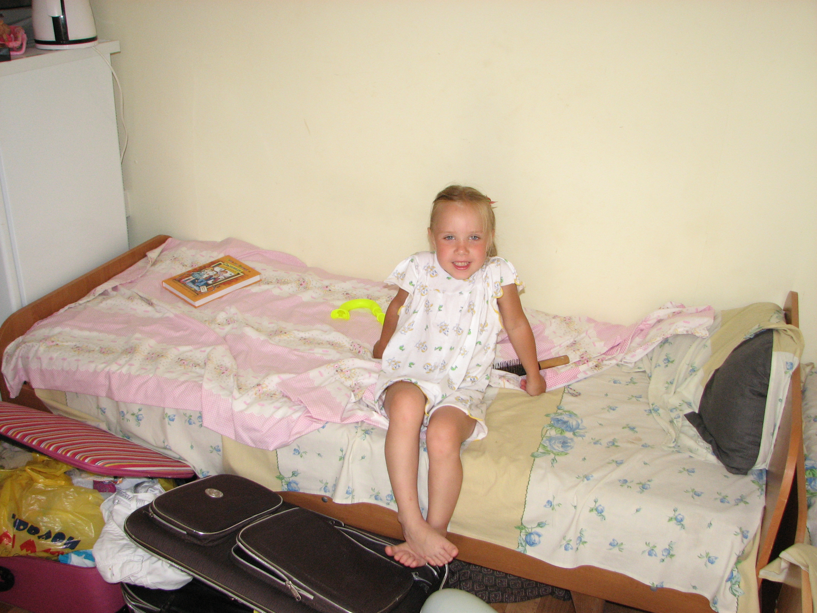 A small girl in a hotel on the seaside.