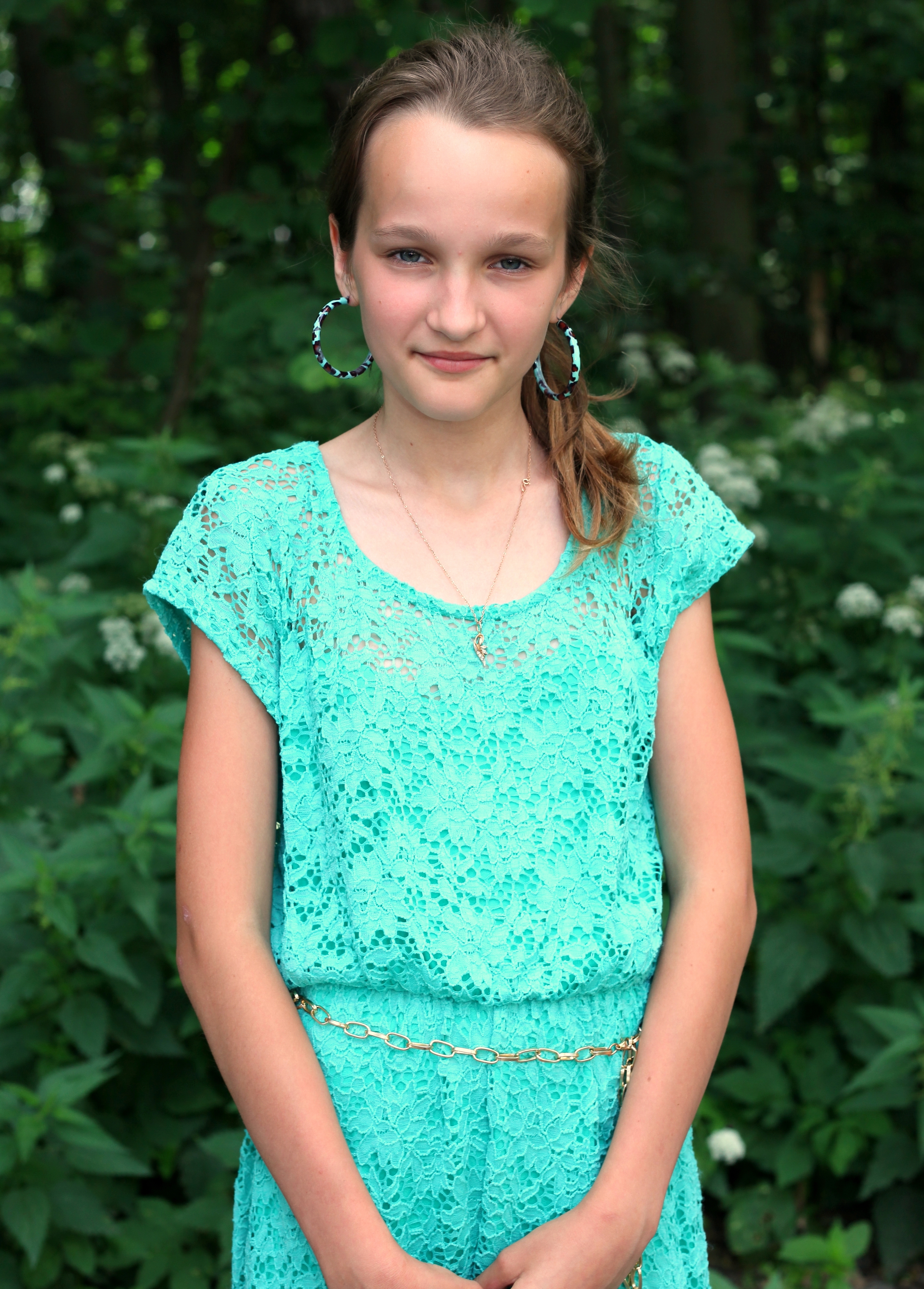 an absolutely beautiful girl with huge earrings, photographed in June 2013, portrait 2/27