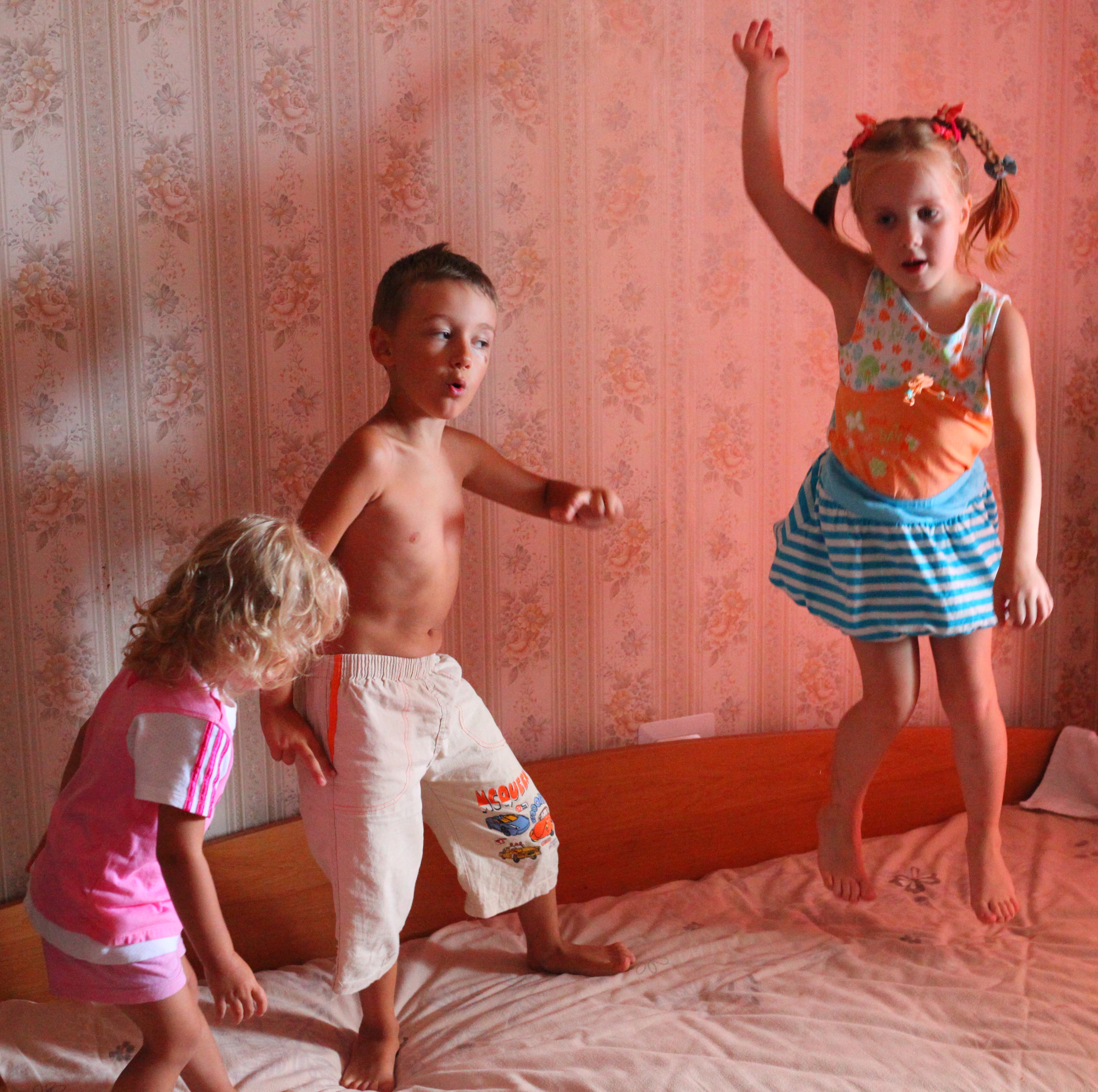 Children dancing on a bed, picture 1