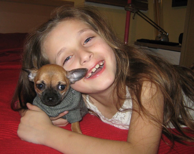 my daughter with her small puppy