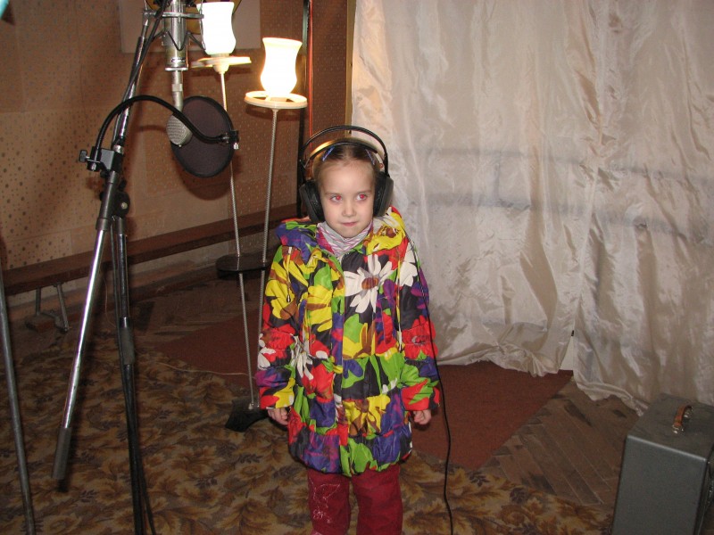 A Catholic girl in a record studio in Lviv, Ukraine - recording a Christian music CD, picture 6.