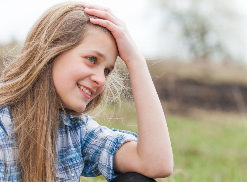 a cute blond 12-year-old girl photographed in April 2015, picture 3