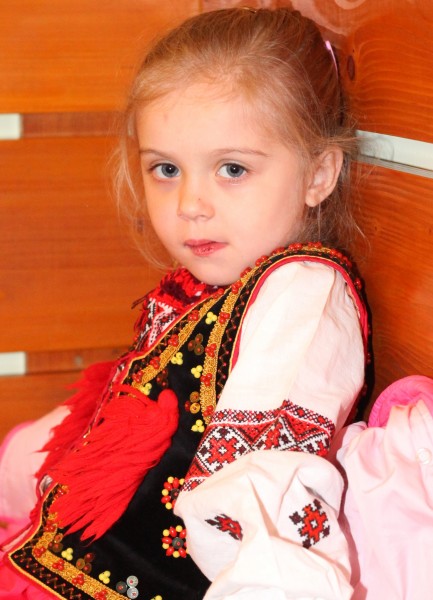 a cute charming beautiful Catholic child girl in a Church, photo 2