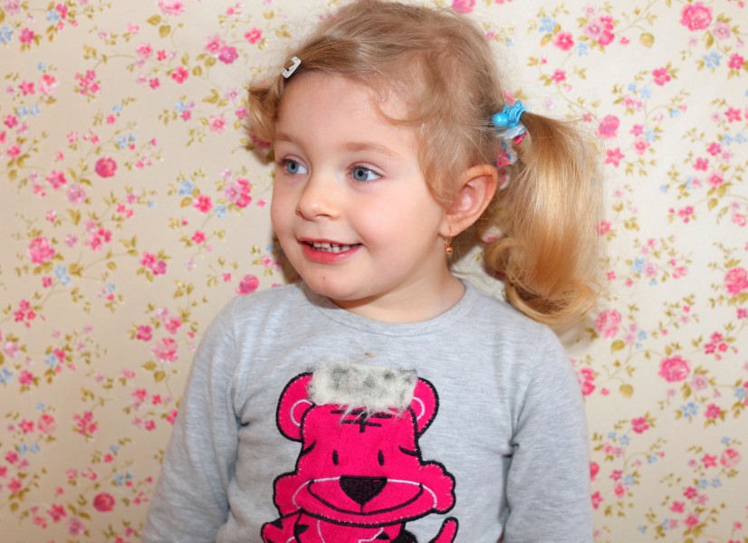 a cute blond child girl with beautiful eyes, photo 1